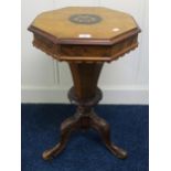 A Victorian octagonal trumpet-style sewing table with burr walnut and floral marquetry top and