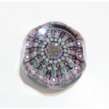 A Perthshire faceted millefiori paperweight, close set with twisting cane, date cane P1994, etched