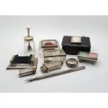 A collection of silver stamp related ephemera, including a silver topped glass stamp roller by