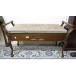 A late C19th/early C20th duet piano stool, with tapestry-upholstered lift-up top, containing a