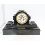 A black slate drum head mantle clock, with S Marti movement and dedication plaque dated 1887