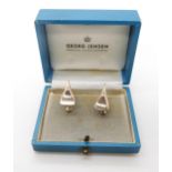 A pair of silver Georg Jensen earrings, pattern number 116A, with screw backs, in original box