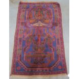 A blue ground tribal rug with allover geometric design, 150cm long x 90cm wide Condition Report: