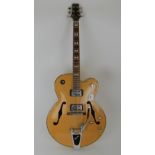 A Peavey Rockingham arch top electric guitar featuring a Bigsby tremolo bar Condition Report: