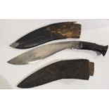 A Kukri in scabbard and another kukri scabbard (af) Condition Report:Available upon request
