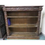 A pair of late-Victorian carved oak open bookcases, with floral and foliate detail and