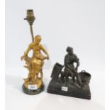 After Moreau, a gilt metal figural table lamp and a spelter figure of a shoe mender Condition