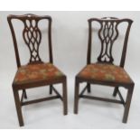 A lot of two Victorian mahogany dining chairs with scroll splats, a beech framed bergere rocking