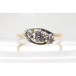 An 18ct and platinum three stone diamond ring, set with estimated approx 0.40cts combined. Finger