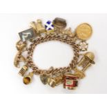 A 9ct gold extensive charm bracelet, stamped 375 9 to every link and the heart clasp, hung with a