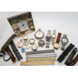 A silver cased desk clock, a collection of vintage watch heads, to include Omega, Longines,