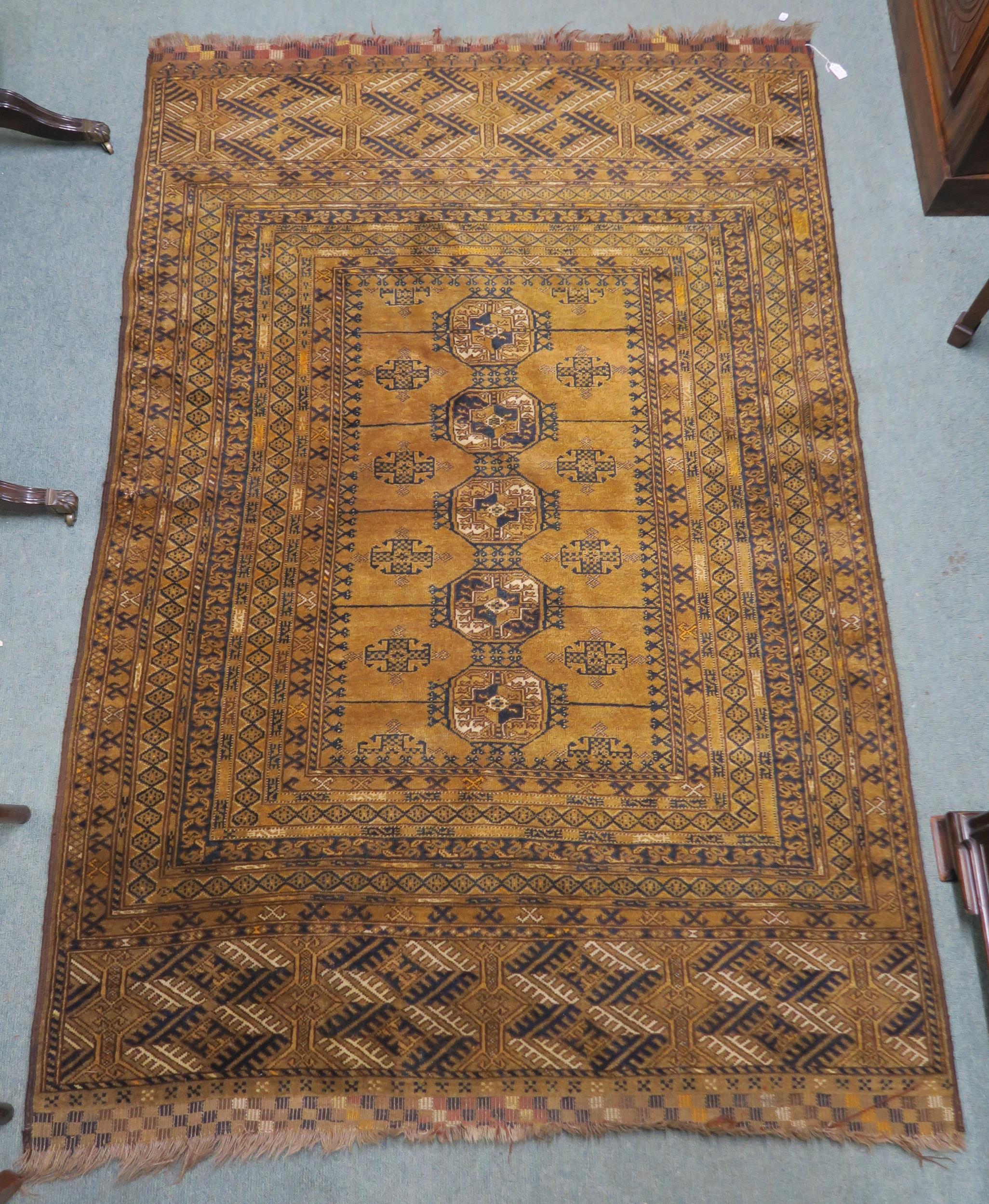 A mustard ground Bokhara rug with multiple borders, 211cm long x 138cm wide Condition Report:
