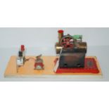 A Mamod steam engine on later formica base, 37cm wide overall Condition Report:Available upon