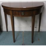 A Victorian mahogany demi lune single drawer fold over tea table on square tapering supports, 77cm