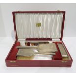 A cased silver four piece vanity set, in the art deco style, with engine turned geometric
