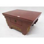 A 19th century Oriental red lacquered single drawer low table Condition Report:Available upon