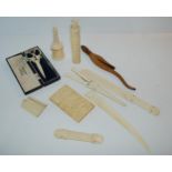 An early 20th century ivory card case, split, 9cm high, needle case, glove stretchers etc