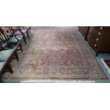 A terracotta ground floral pattern rug, 369cm long x 269cm wide Condition Report:Available upon