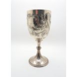 A Victorian silver goblet, with chase and embossed scrolling foliage decoration surrounding two