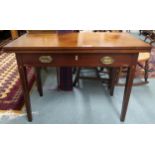 A Victorian mahogany single drawer fold over tea table on square tapering supports, 74cm high x
