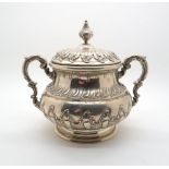 A continental twin handled white metal sugar bowl, of cauldron form with repousse rocaille
