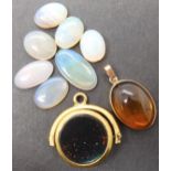 A collection of seven loose white and jelly opals largest 17.6mm x 9.5mm x 2.7mm, smallest 11.2mm
