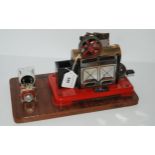 A Mamod steam engine on later hardwood base, 30cm wide overall Condition Report:Available upon