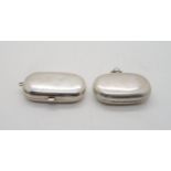 An Edwardian silver sovereign case, of plain form with two articulated holders, one for a full