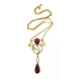 A 9ct gold Edwardian pendant and chain, set with garnets and a faux pearl, length of pendant 5cm,