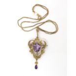 A 9ct gold pearl and amethyst Edwardian pendant weight 6.3gms, with a gold plated chain Condition