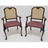 A pair of Edwardian mahogany bergere back armchairs, black lacquered bergere parlour armchair and