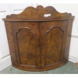 A Victorian walnut two door hanging corner cabinet and an upholstered armchair (2) Condition