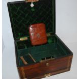 A Victorian rosewood and brass bound jewellery box (af) with lower drawer and recess handles, with