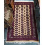 A cream ground Bokhara rug with all over lozenge design red borders, 197cm long x 127cm wide