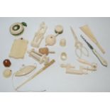 A small collection of early 20th century ivory pieces including shoe horn, pin cushion etc