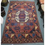 A multicoloured ground Caucasian rug with geometric central medallion and multicoloured borders,