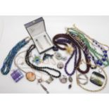 Garnet and amethyst beads, silver brooches, a butterfly pendant and other items Condition Report: