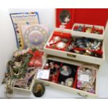A musical jewellery box full of costume jewellery, to include gemstone guides etc Condition Report:
