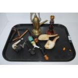 A tray lot including various smoking pipes, brass taper and candle stick Condition Report: