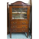 A Victorian mahogany peer cabinet with single glazed door above three drawers on square tapering