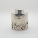 A silver tea caddy, of oval form with repousse decoration depicting a pastoral scene, by George