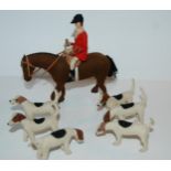 A felt hunt horse, rider and six hounds, horse, 16cm wide Condition Report:Available upon request