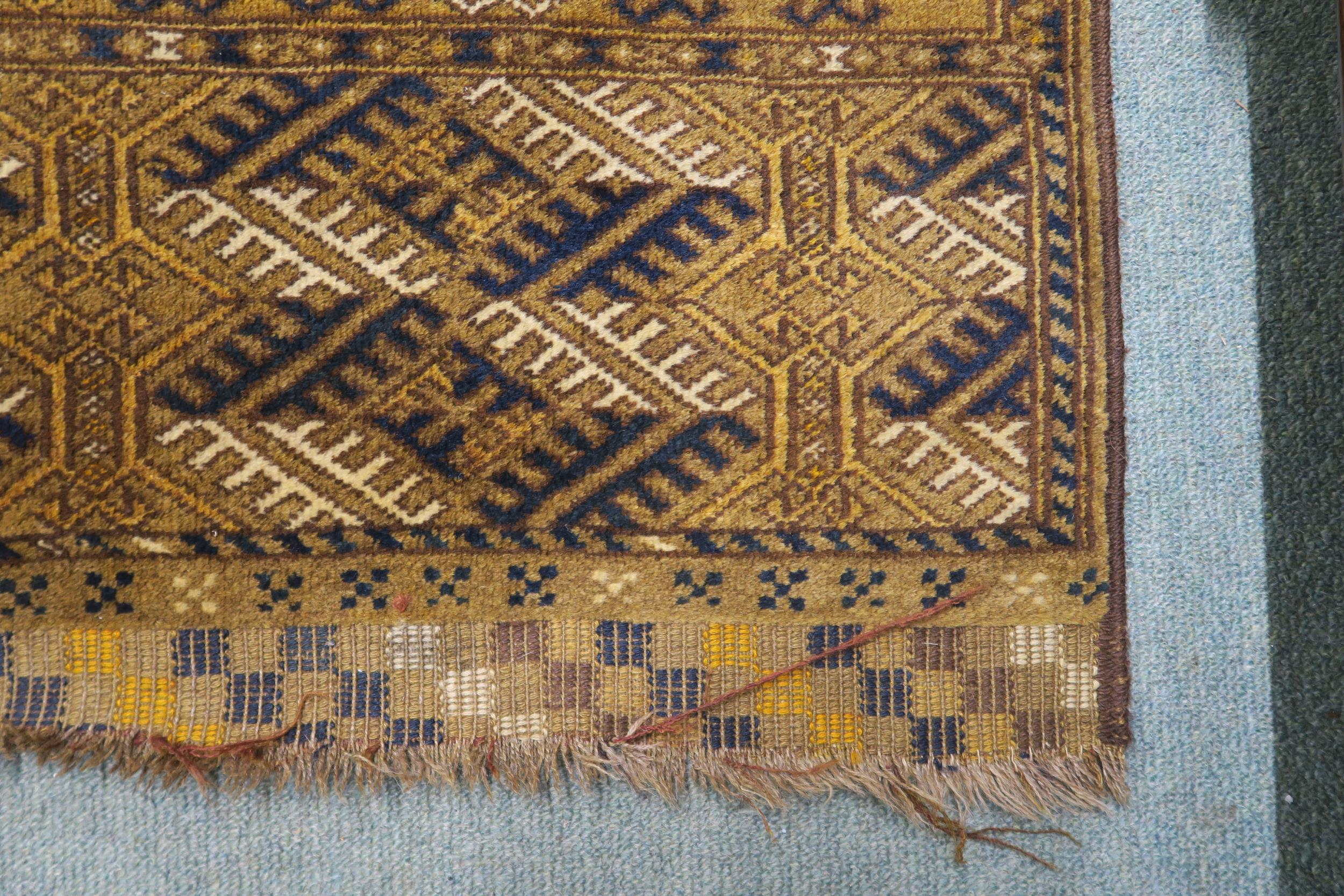 A mustard ground Bokhara rug with multiple borders, 211cm long x 138cm wide Condition Report: - Image 3 of 4