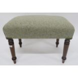 A Victorian mahogany framed footstool upholstered in a contemporary wool fabric on turned supports