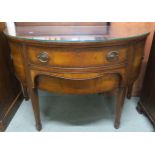 A 20th century mahogany demi lune sideboard with two central drawers flanked by cabinet doors on