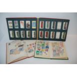 An album of cigarette cards, stamp albums and loose stamps Condition Report:Available upon request