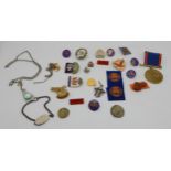 A small collection of badges, medals and pendants. Condition Report:Available upon request
