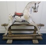 A Victorian white painted rocking horse on pine base Condition Report:Available upon request