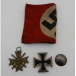 A German WW2 Iron Cross with mark to the rear 1/18 together with a German 1939 medal and an