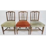 A lot of three late Georgian elm framed dining chairs with upholstered seats on stretchered square